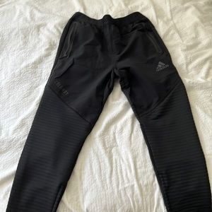 black adidas pants with zipper pockets